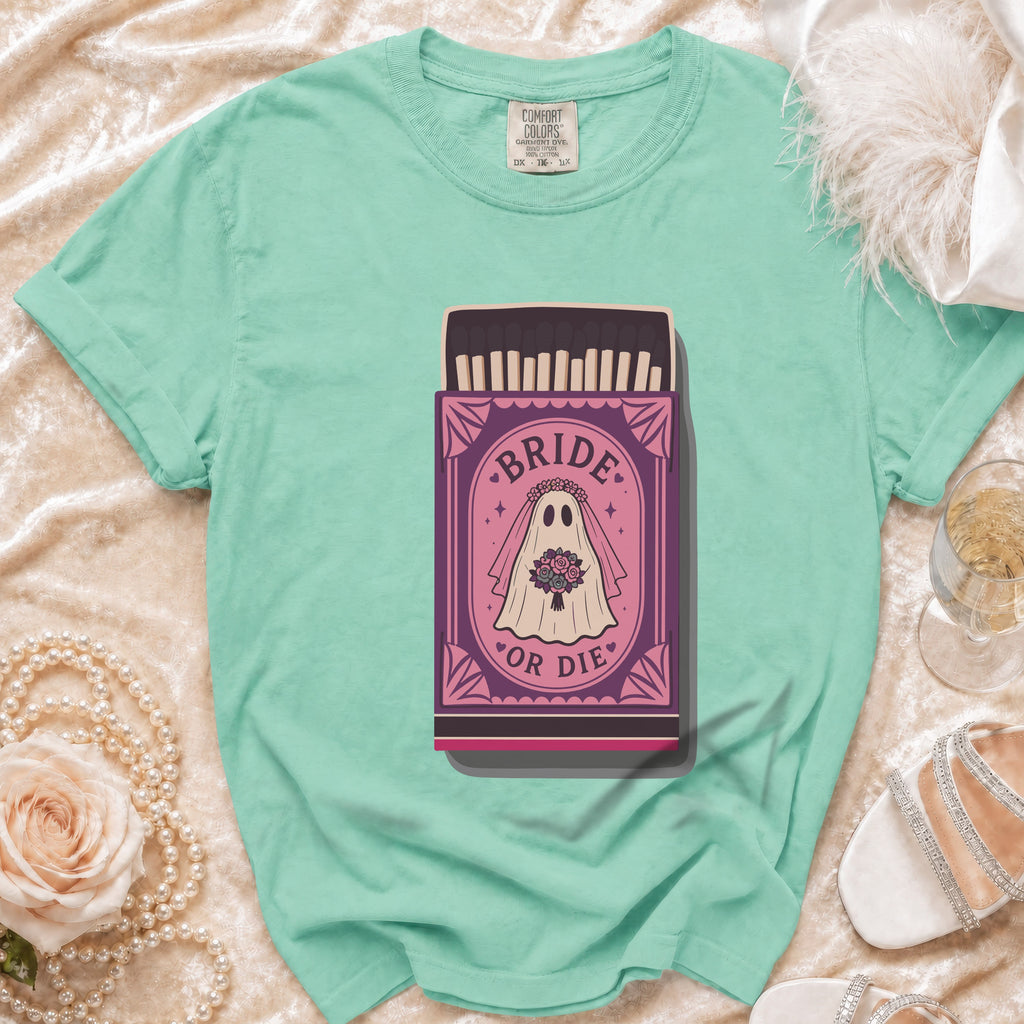 Mint t-shirt with a "Bride or Die" ghost graphic on a matchbox.