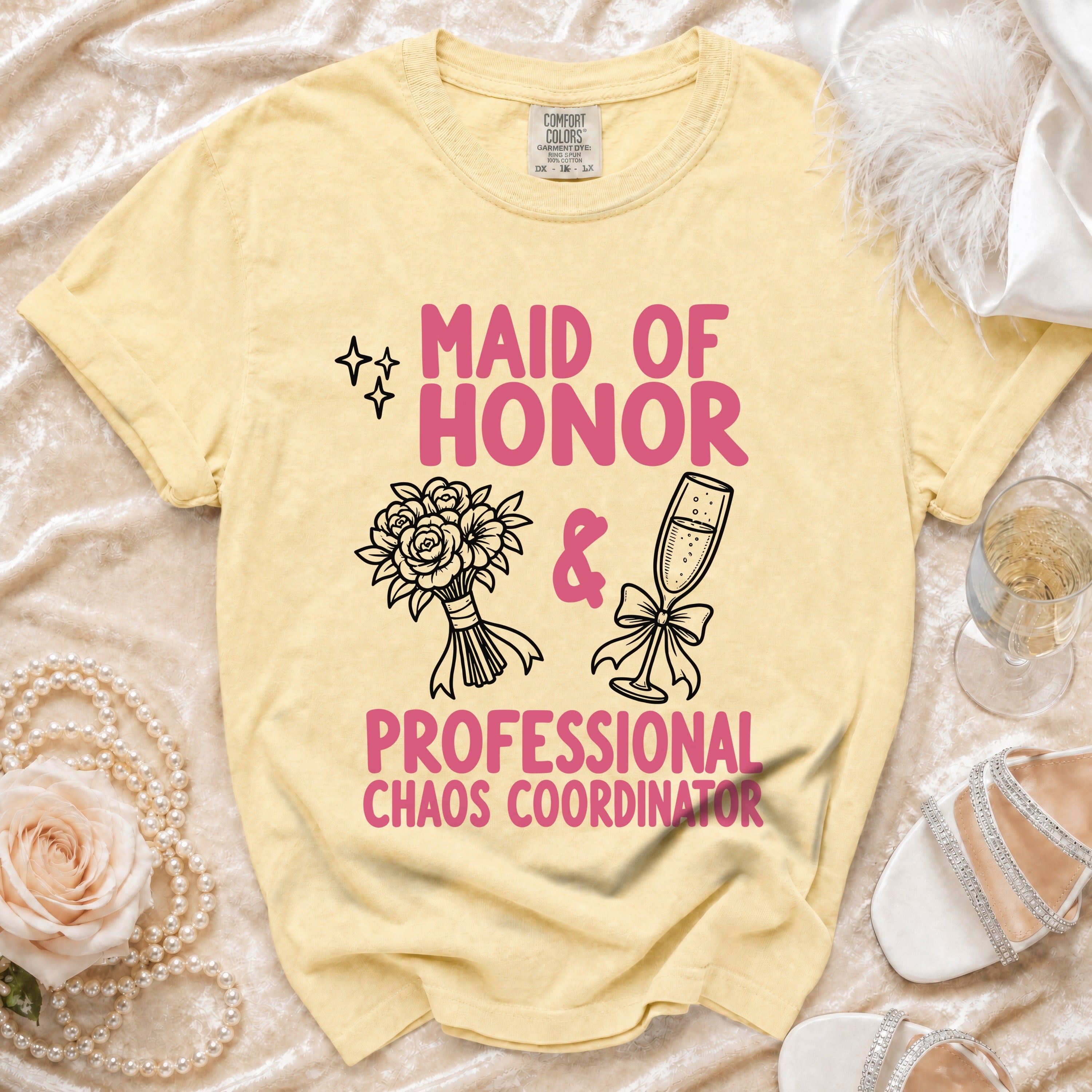 Yellow t-shirt with pink text "Maid of Honor" and "Professional Chaos Coordinator".