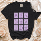 Black t-shirt with a grid of nine purple postage stamp illustrations with spooky wedding themes.