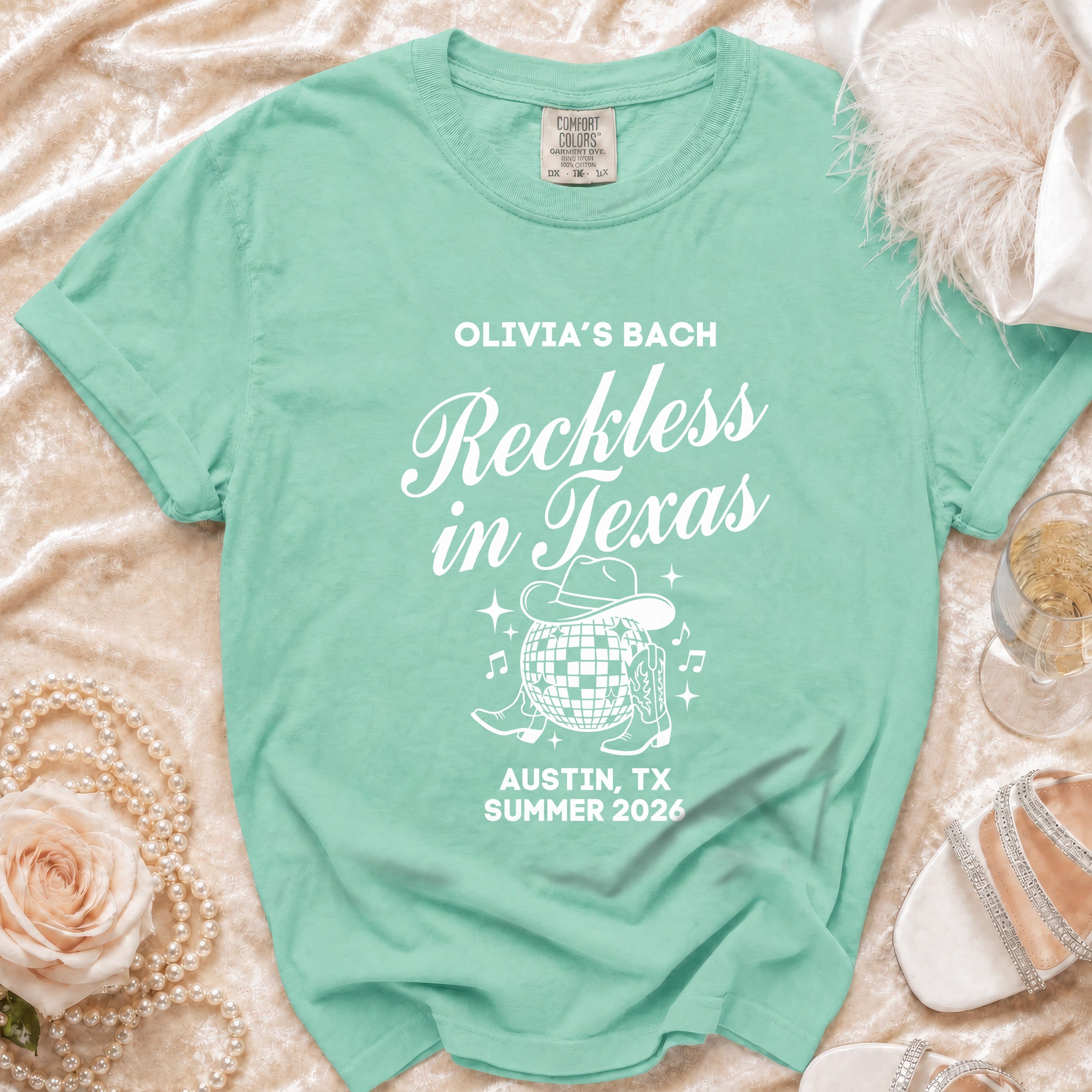 Green Comfort Colors t-shirt for Olivia's Bach "Reckless in Texas" Austin, TX Summer 2026.