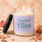 Lit candle in a glass jar with a label reading "Married Bliss and slightly better sleep."