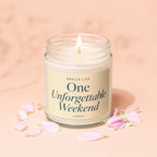 Jar candle with lit flame, reads "Smells Like One Unforgettable Weekend."