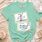 Mint green t-shirt with "Austin, TX" and "Reckless in Texas Olivia's Bach" text.