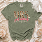 Green t-shirt with "MRS." in leopard print and "just married" text.