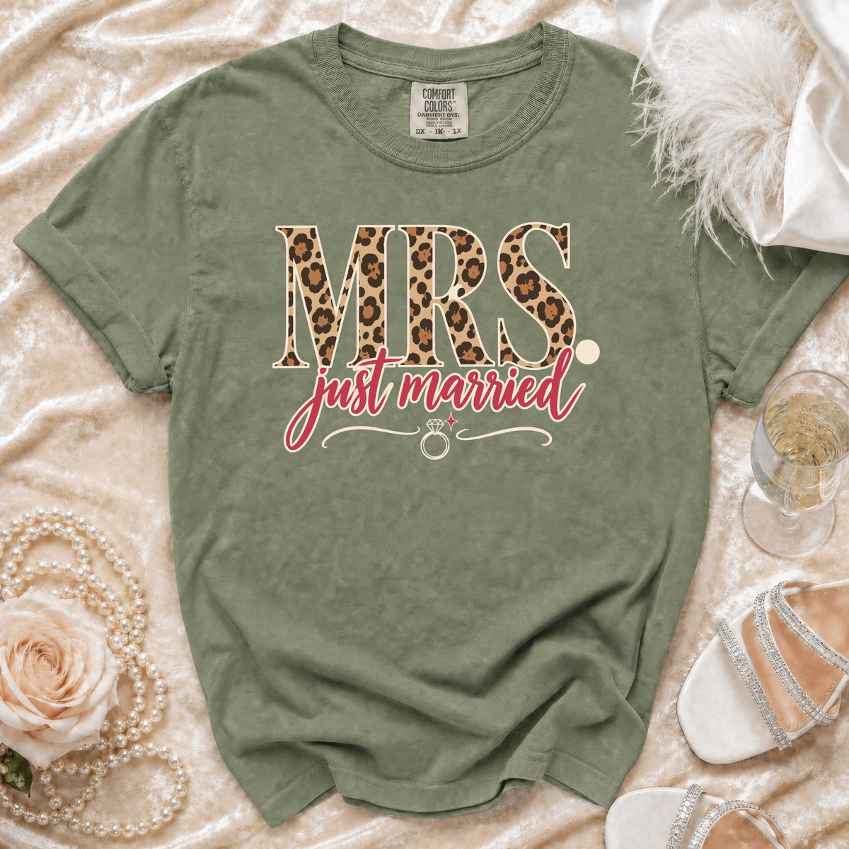 Green t-shirt with "MRS." in leopard print and "just married" text.