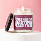 Jar candle with lid off, lit wick, and quote "Together is a beautiful place to be".