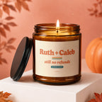Amber glass candle with label saying "Ruth + Caleb still no refunds Since 2009".