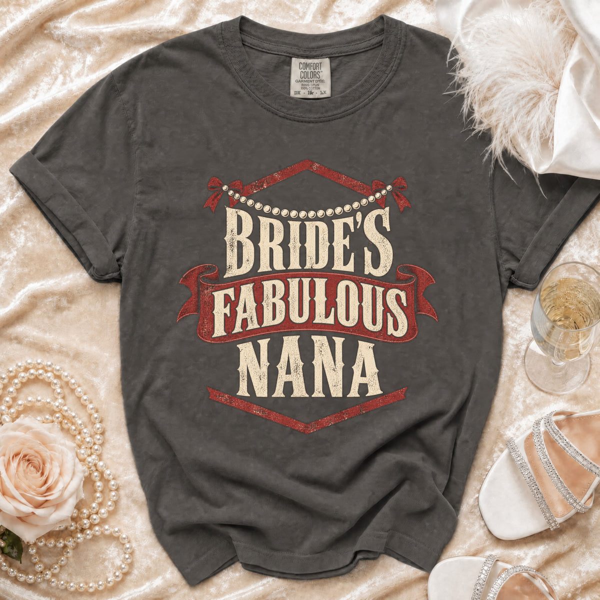 Dark grey t-shirt with "Bride's Fabulous Nana" text, pearls, rose, and champagne.