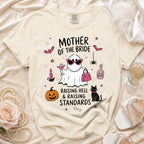 T-shirt with ghost graphic that says "Mother of the Bride Raising Hell & Raising Standards."