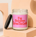 Glass candle with pink label reading "I've Been Given Earned This Candle VOWED".