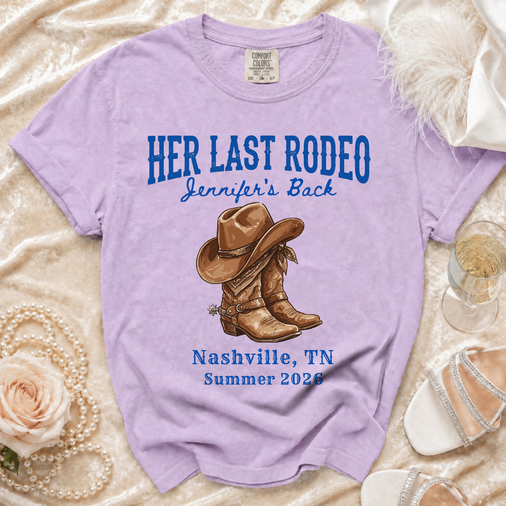 Lavender t-shirt with "Her Last Rodeo" and cowboy boots graphic.