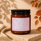 Amber candle with pink label that reads "Two brides, better than one" and "VOWED".