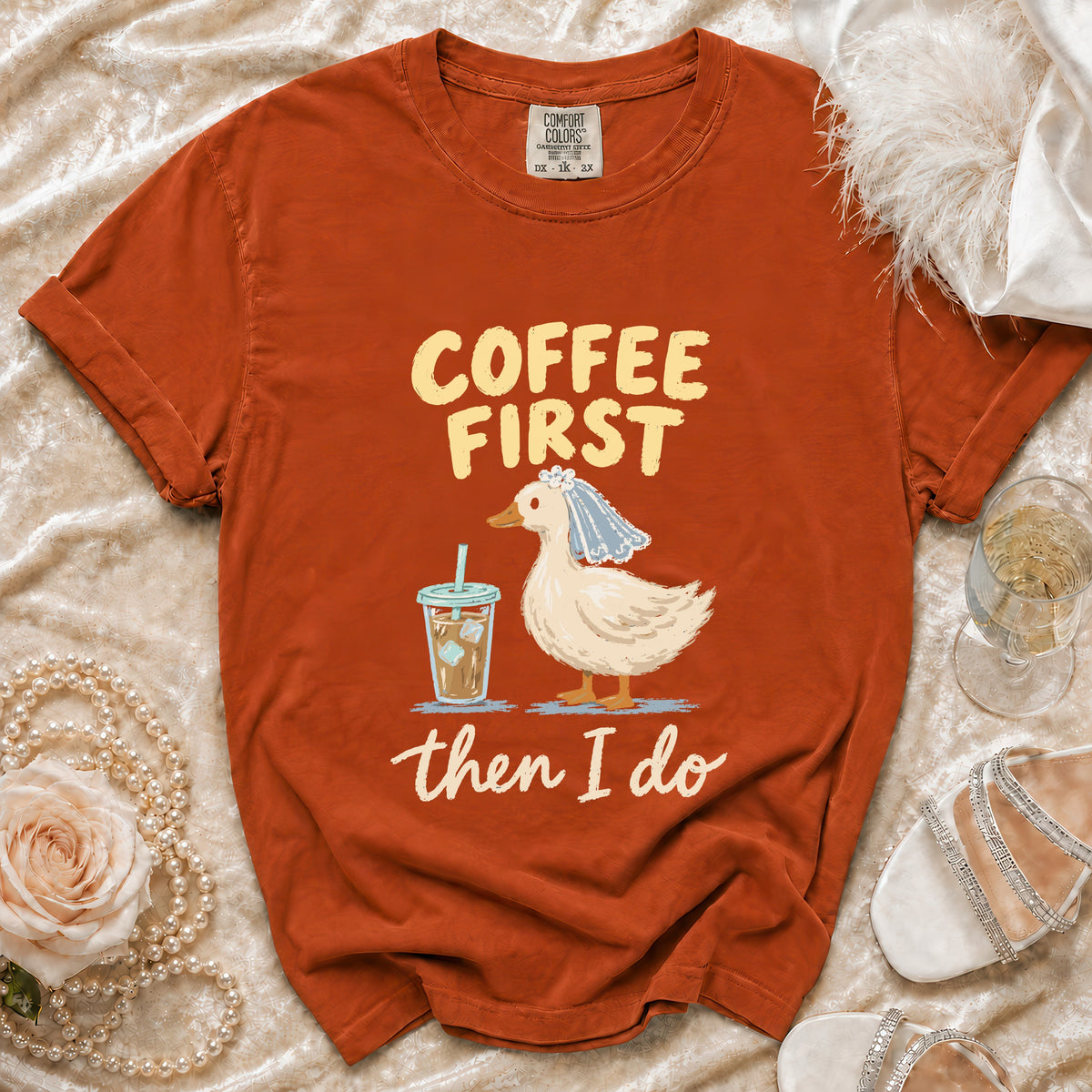 Orange t-shirt with "Coffee First then I Do" text and a duck with a veil.