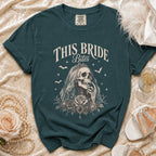 Teal t-shirt with "This Bride Bites" text and a skeletal bride illustration.