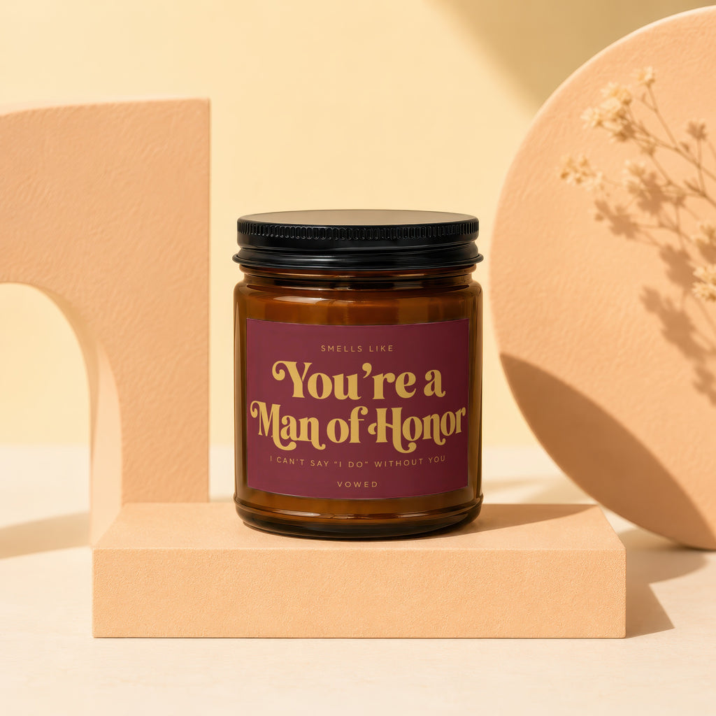 Brown candle with "You're a Man of Honor" text on burgundy label.