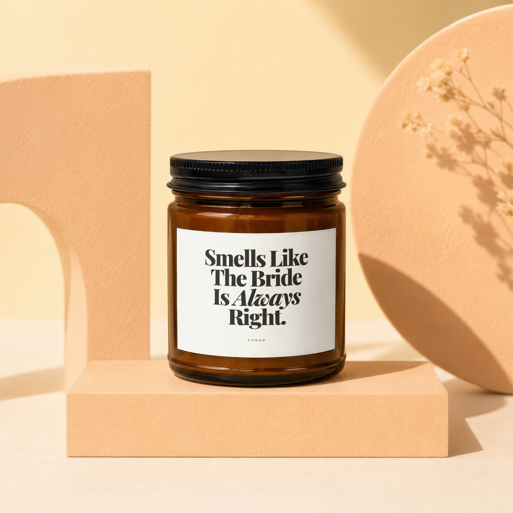 Amber jar candle with black lid and white label reading "Smells Like The Bride Is Always Right."