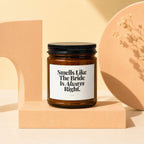 Amber jar candle with black lid and white label reading "Smells Like The Bride Is Always Right."