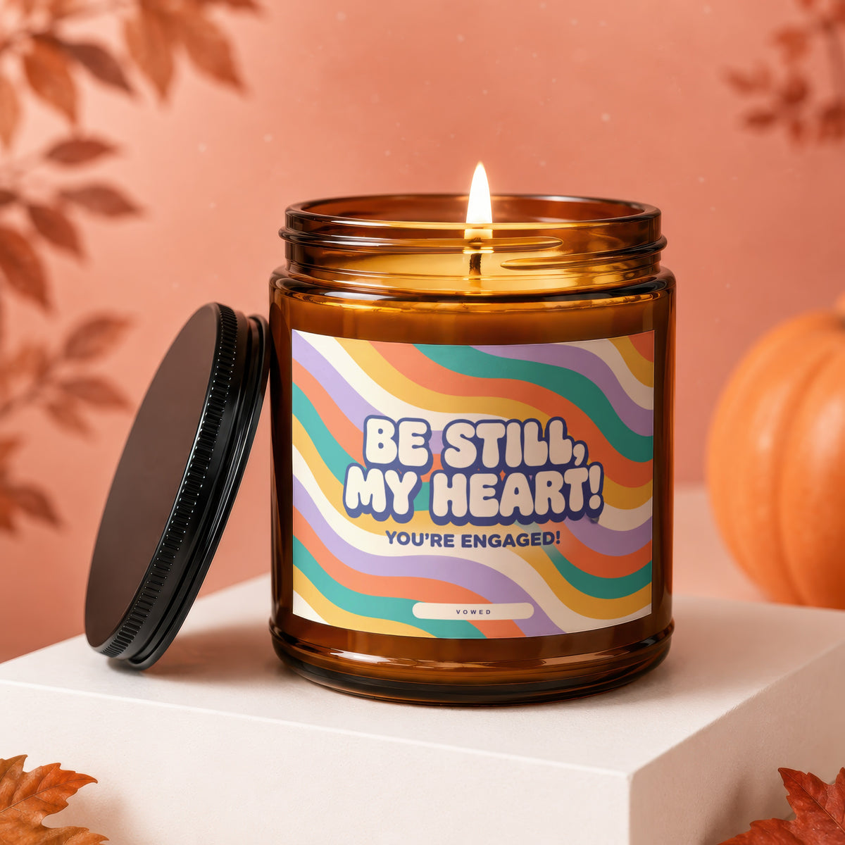 Amber candle with "Be Still, My Heart! You're Engaged!" on label.