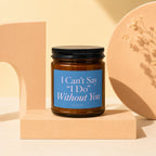 Brown glass candle with blue label reading, "I Can't Say 'I Do' Without You".
