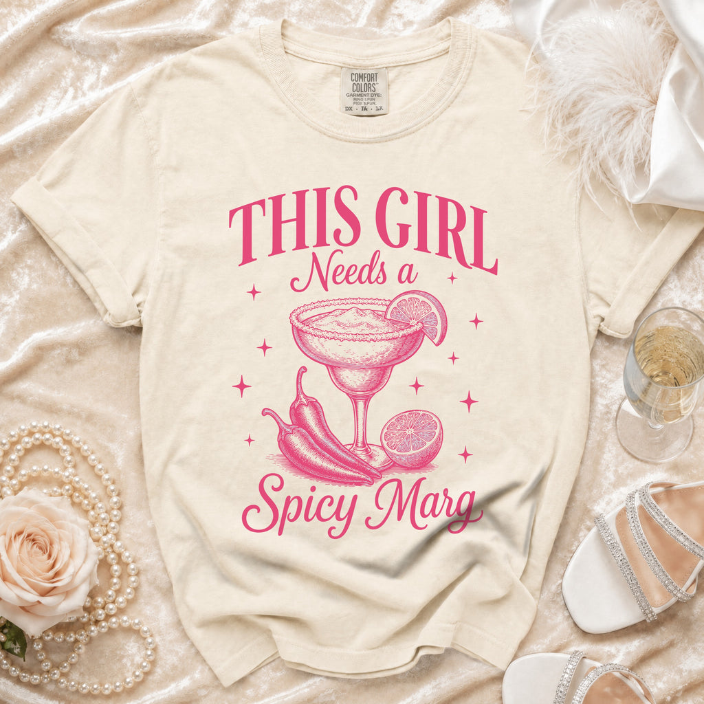 Cream t-shirt with pink text and graphics reads "THIS GIRL Needs a Spicy Marg".