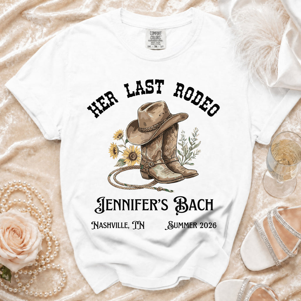 White t-shirt with "Her Last Rodeo Jennifer's Bach Nashville, TN Summer 2026" and cowboy boots graphic.