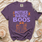 Purple t-shirt featuring the text Mother of the Bride Boos and an orange ghost graphic.