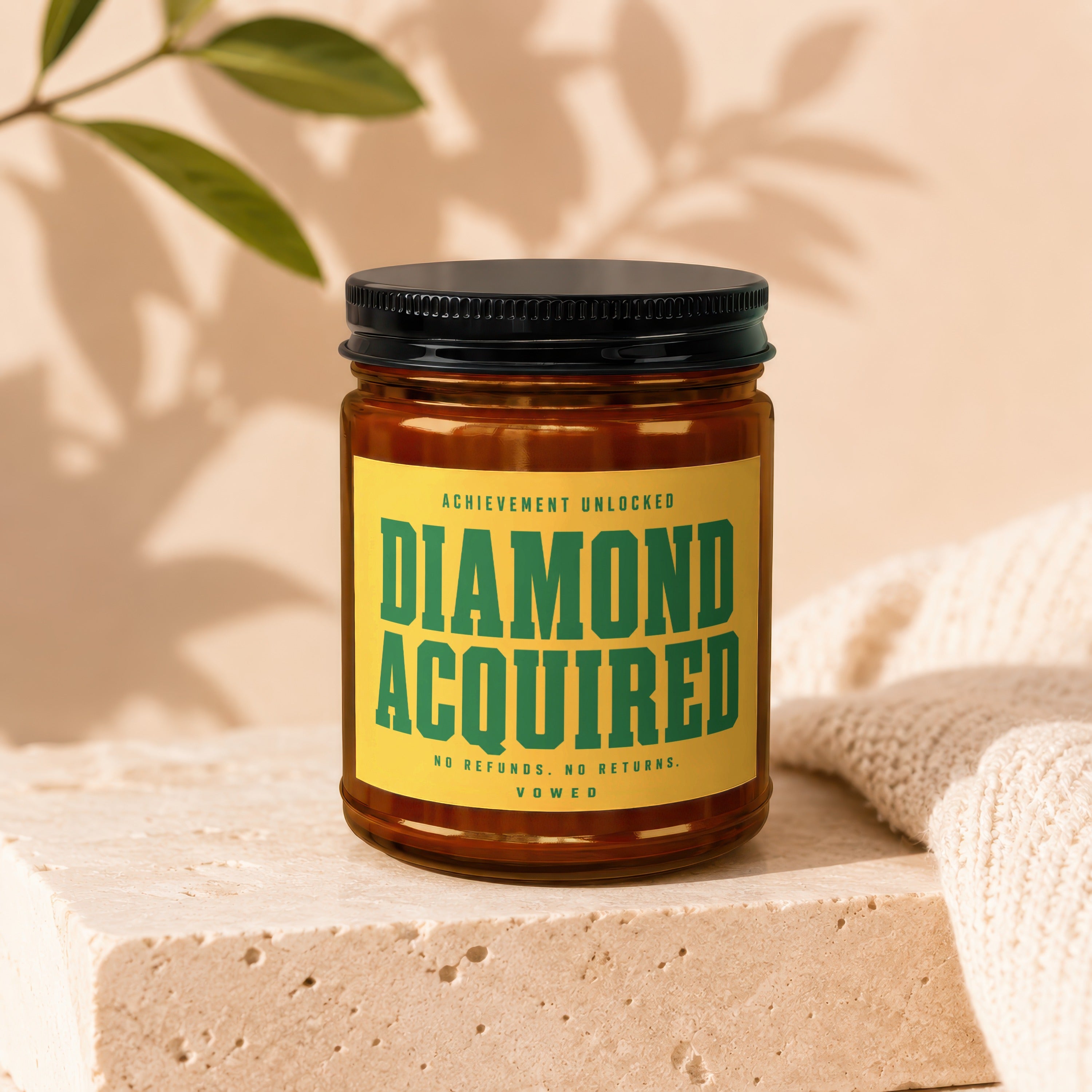 Candle with yellow label reading "Achievement unlocked diamond acquired".