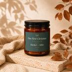 Amber jar candle labeled "Our First Christmas Engaged Harper + Miles 2026".