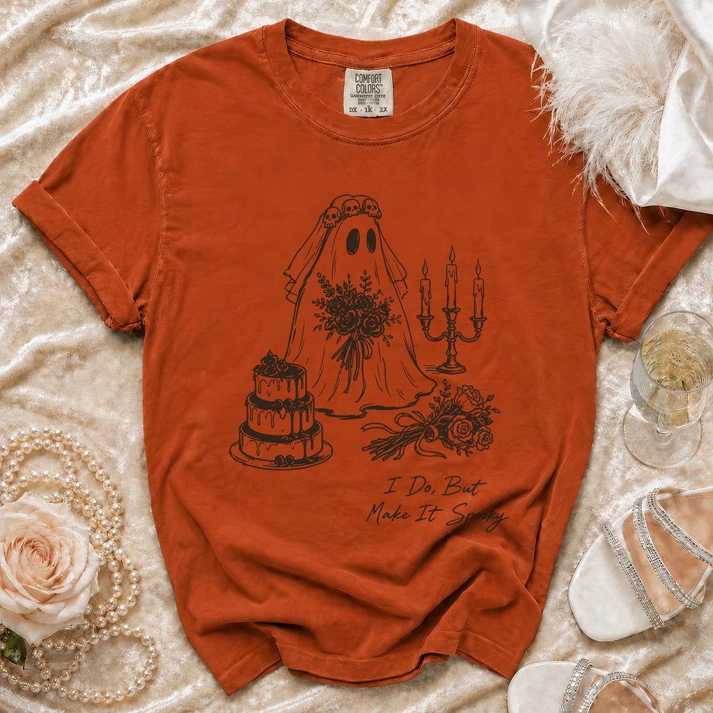 Orange t-shirt with ghost bride, cake, and candles graphic that reads "I Do, But Make It Spooky."