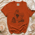Orange t-shirt with ghost bride, cake, and candles graphic that reads "I Do, But Make It Spooky."