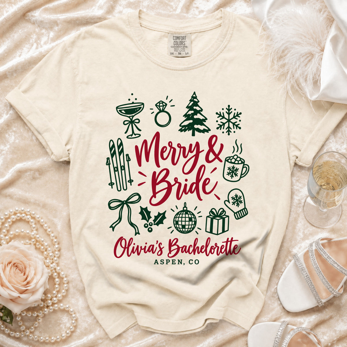 Cream t-shirt with "Merry & Bride" and holiday icons, "Olivia's Bachelorette Aspen, CO."
