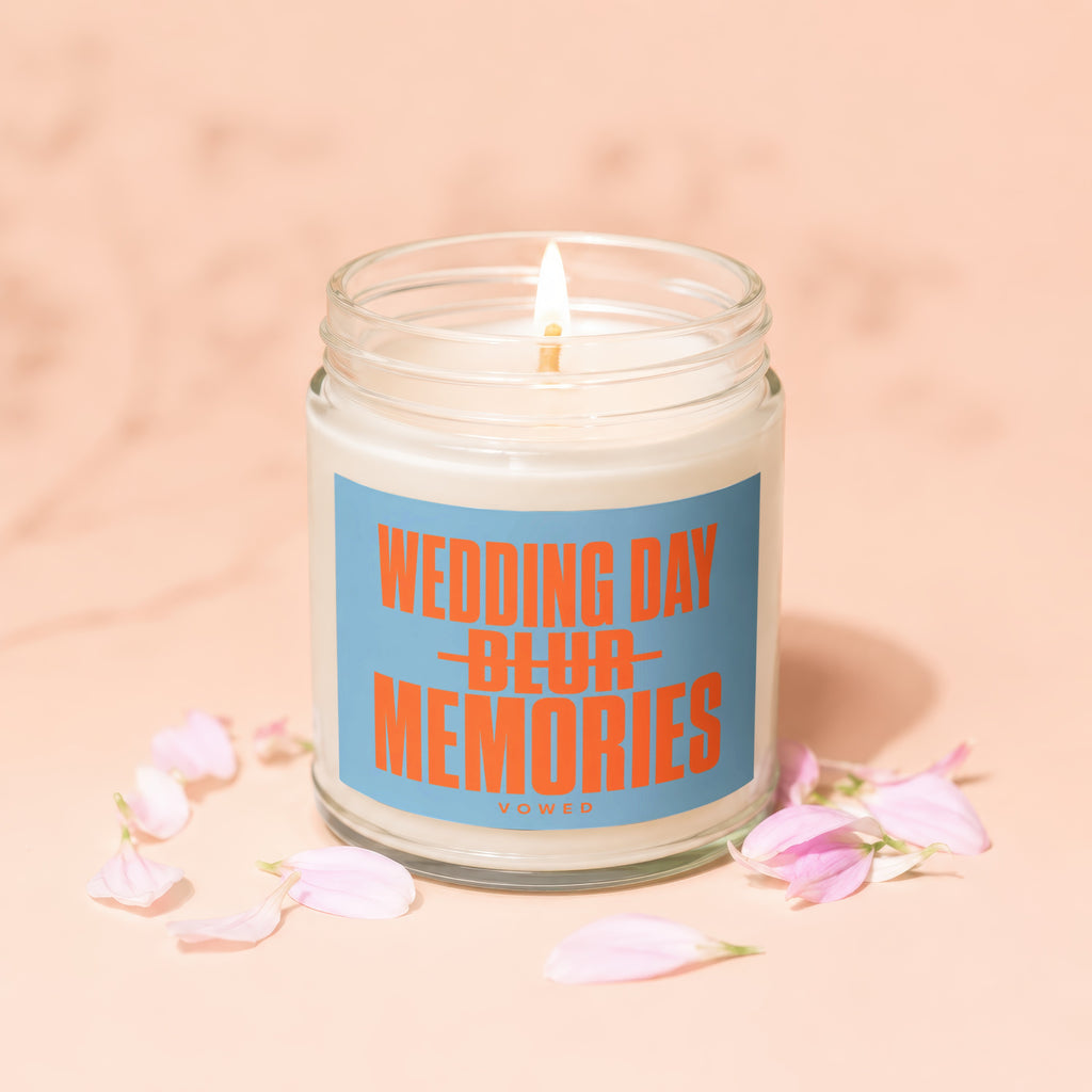 Candle with orange text "WEDDING DAY BLUR MEMORIES" on a blue label.