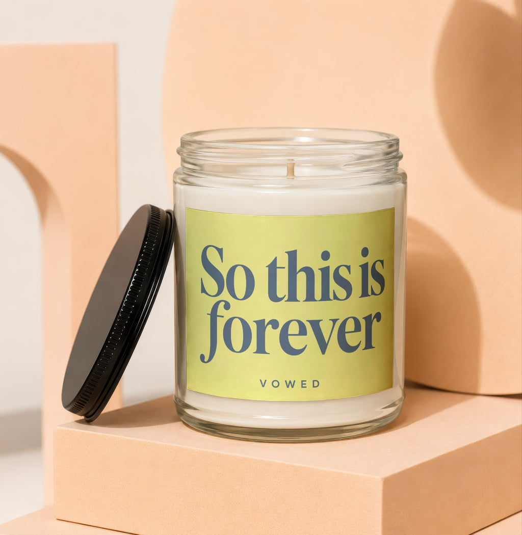 Glass jar candle with "So this is forever" text on yellow label.