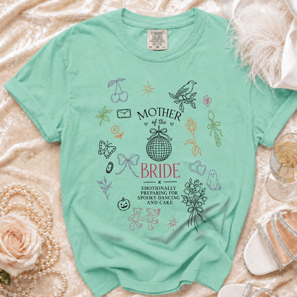 Mint t-shirt with "Mother of the Bride" and graphics of teddy bears, ghost, and disco ball.