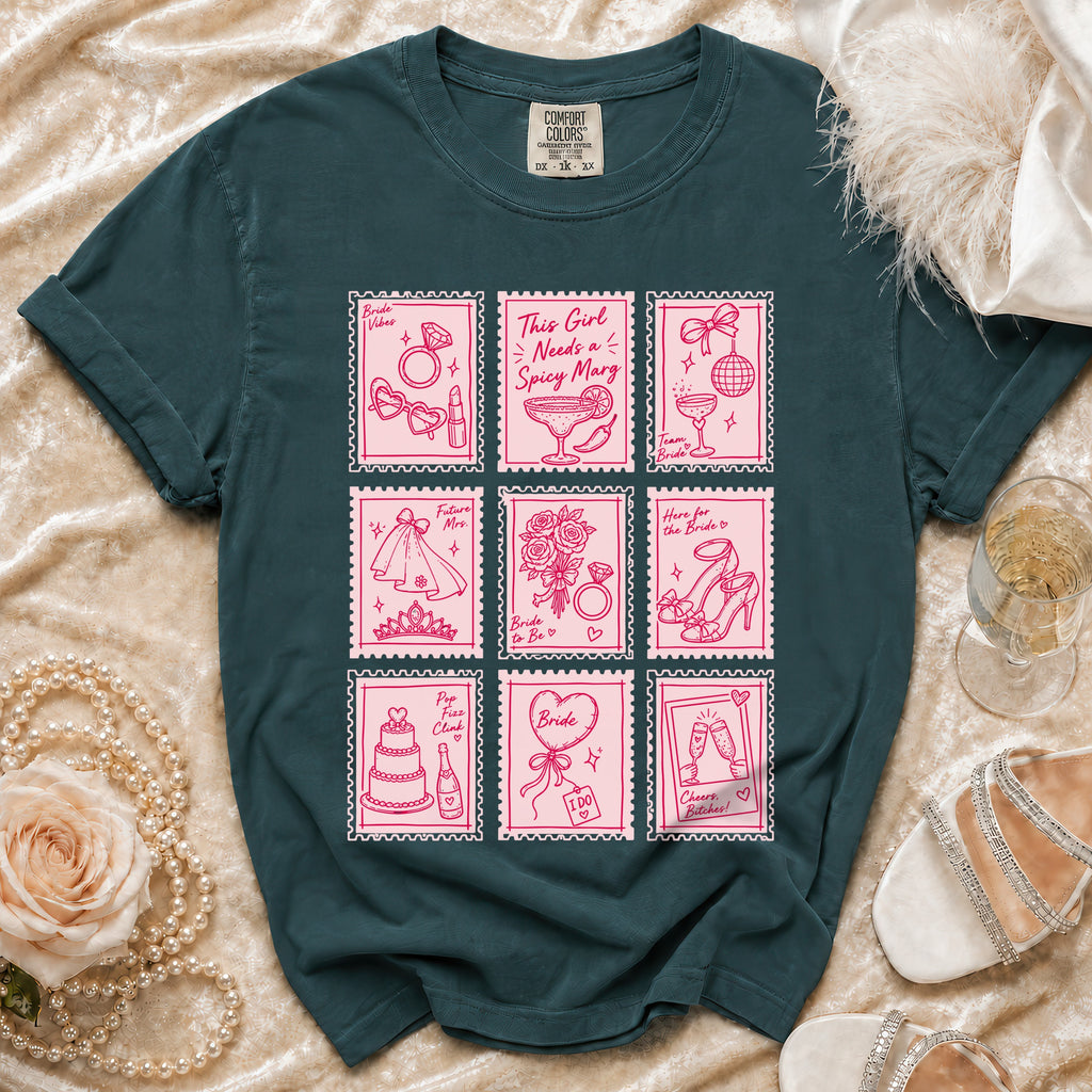 Teal t-shirt with pink stamp graphics of wedding symbols and text.