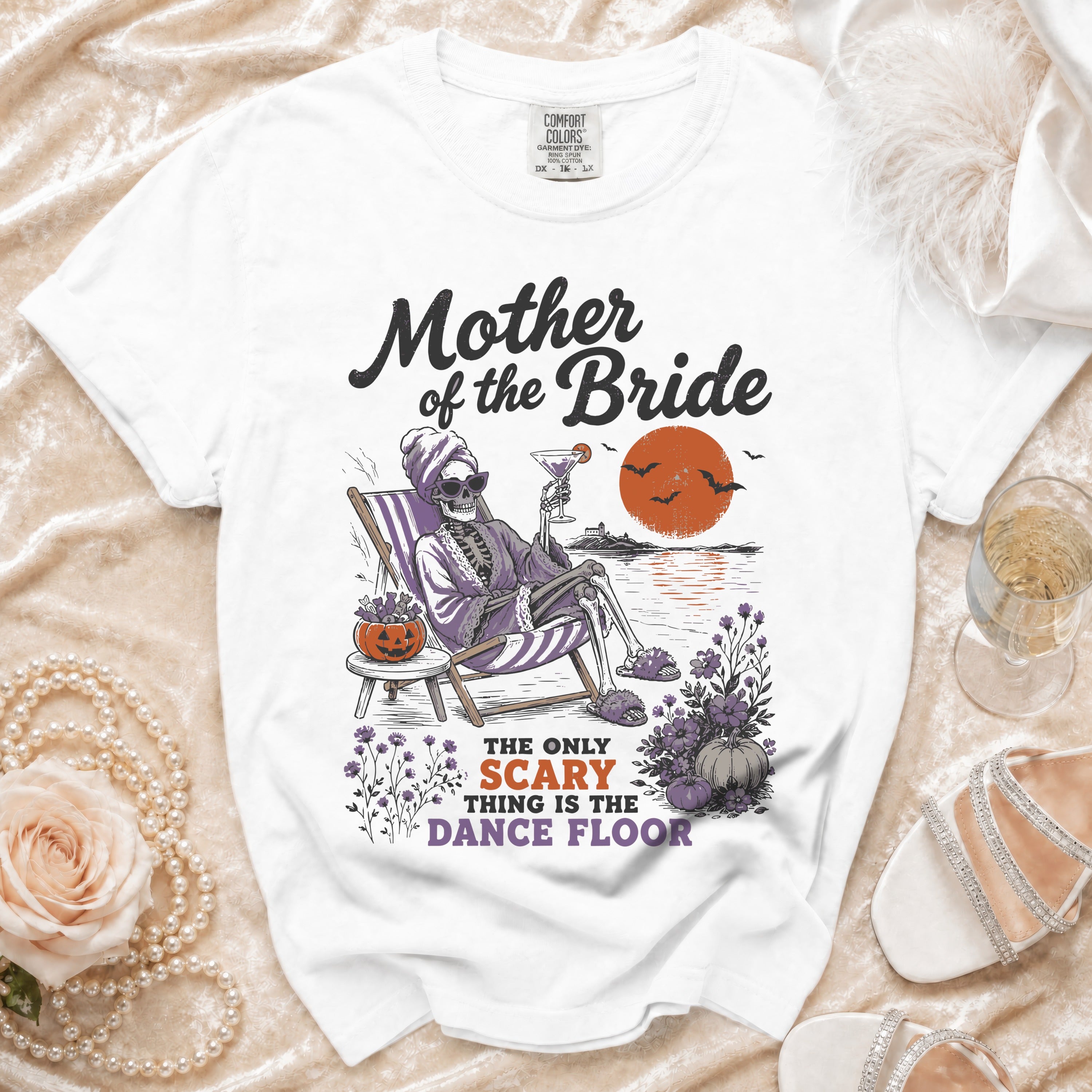 White t-shirt with "Mother of the Bride" and "The only scary thing is the dance floor" text.