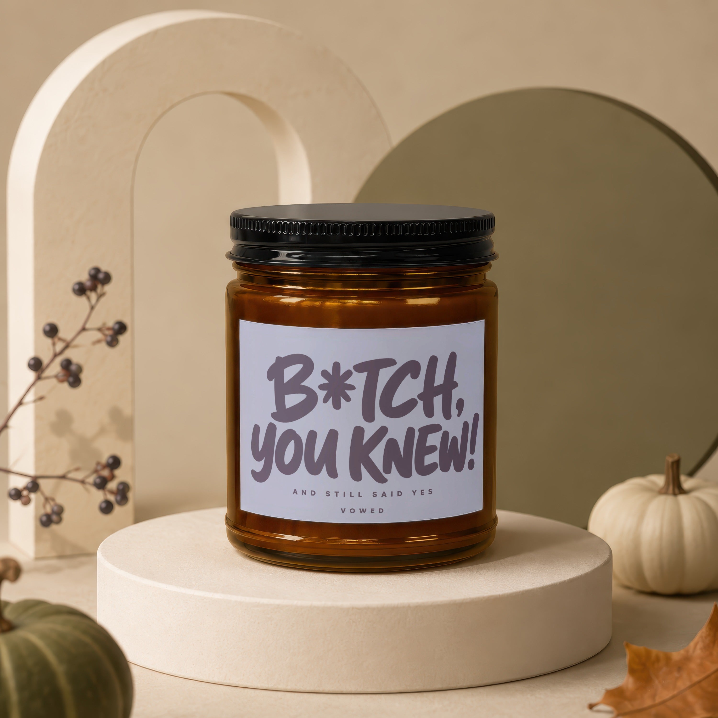 Amber glass candle with black lid reads "B*TCH, YOU KNEW! AND STILL SAID YES VOWED".