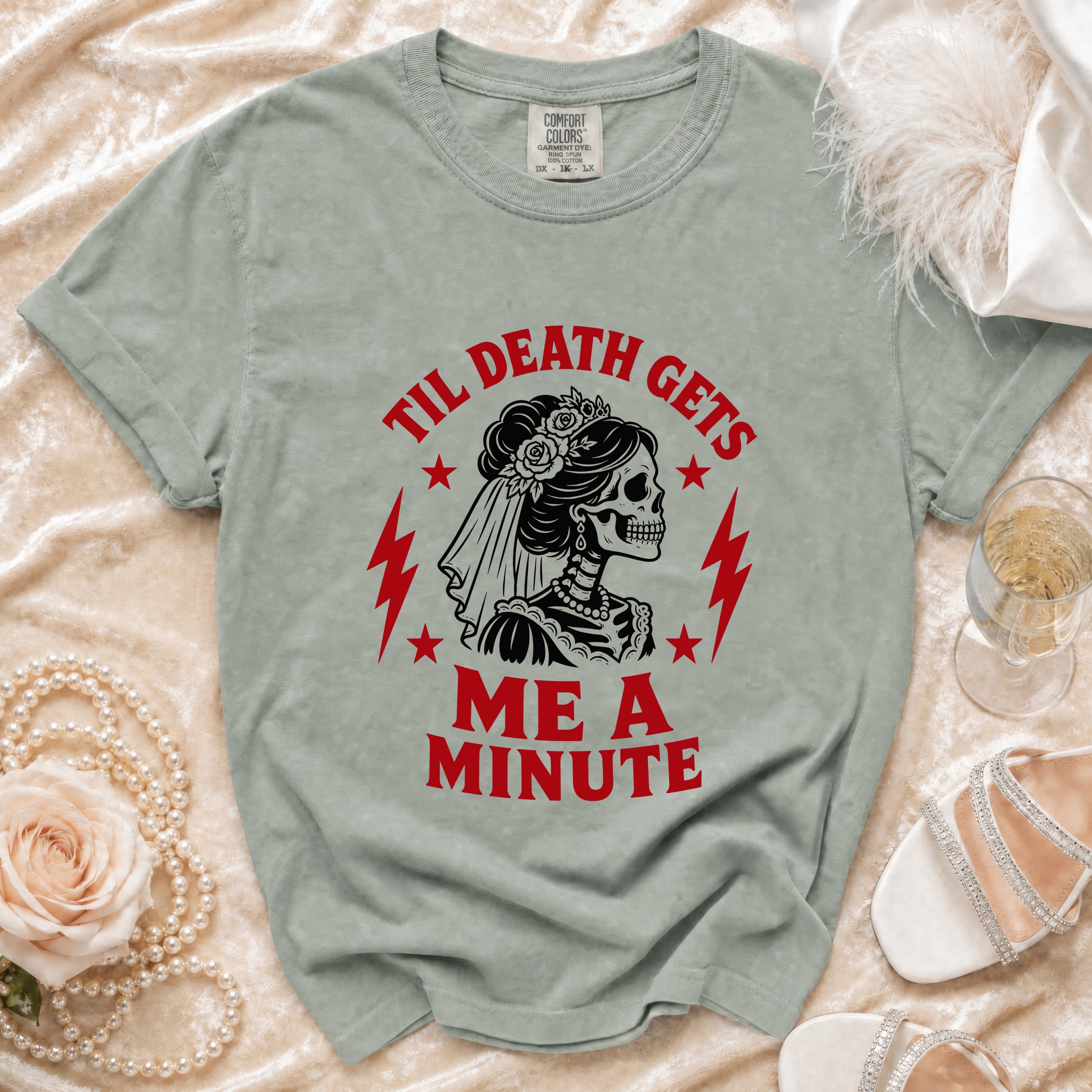 T-shirt with skeleton bride graphic and text "Til Death Gets Me A Minute".