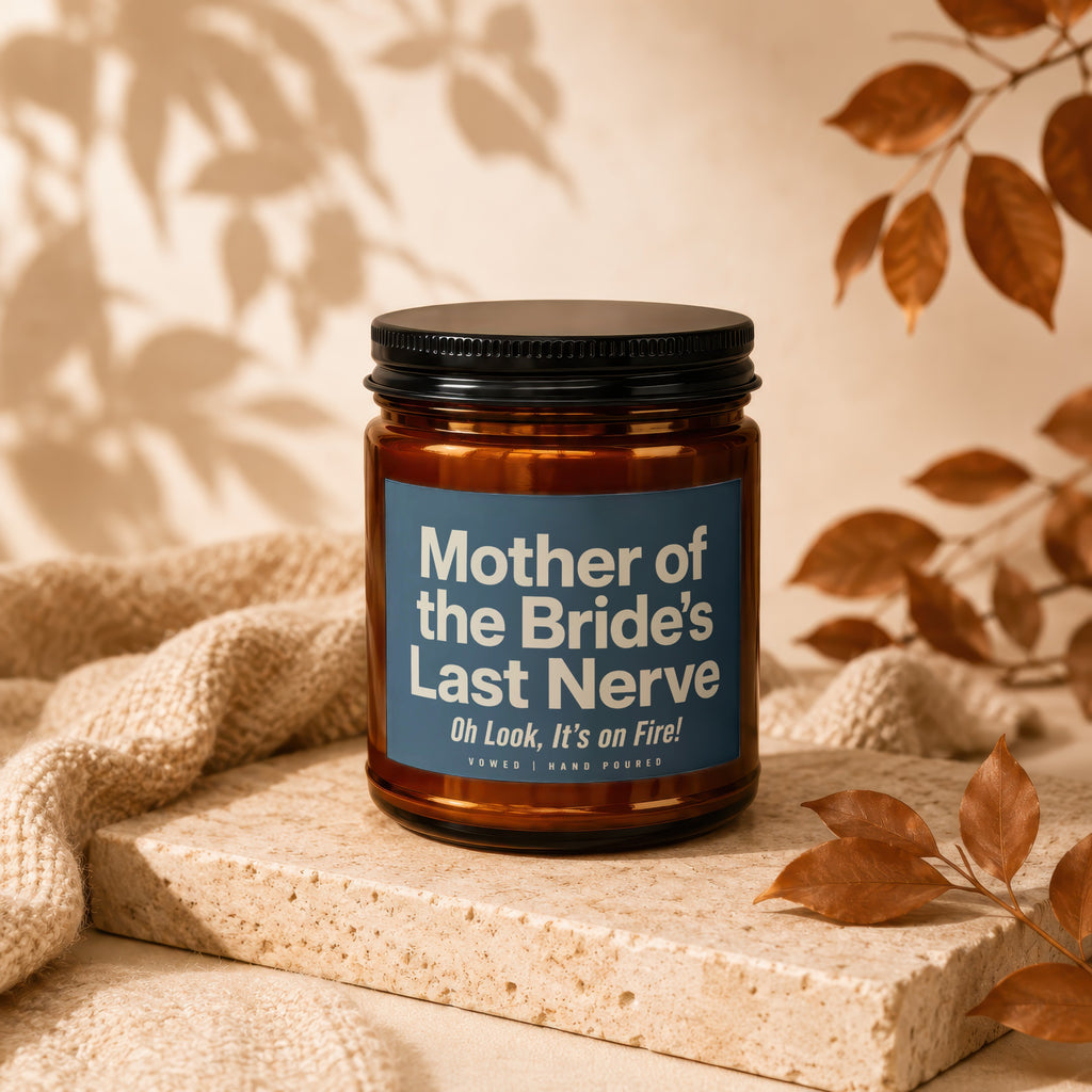 Amber candle with blue label reading "Mother of the Bride's Last Nerve".