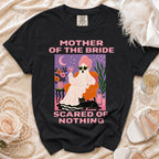 Black t-shirt with "Mother of the Bride Scared of Nothing" text and ghost graphic.