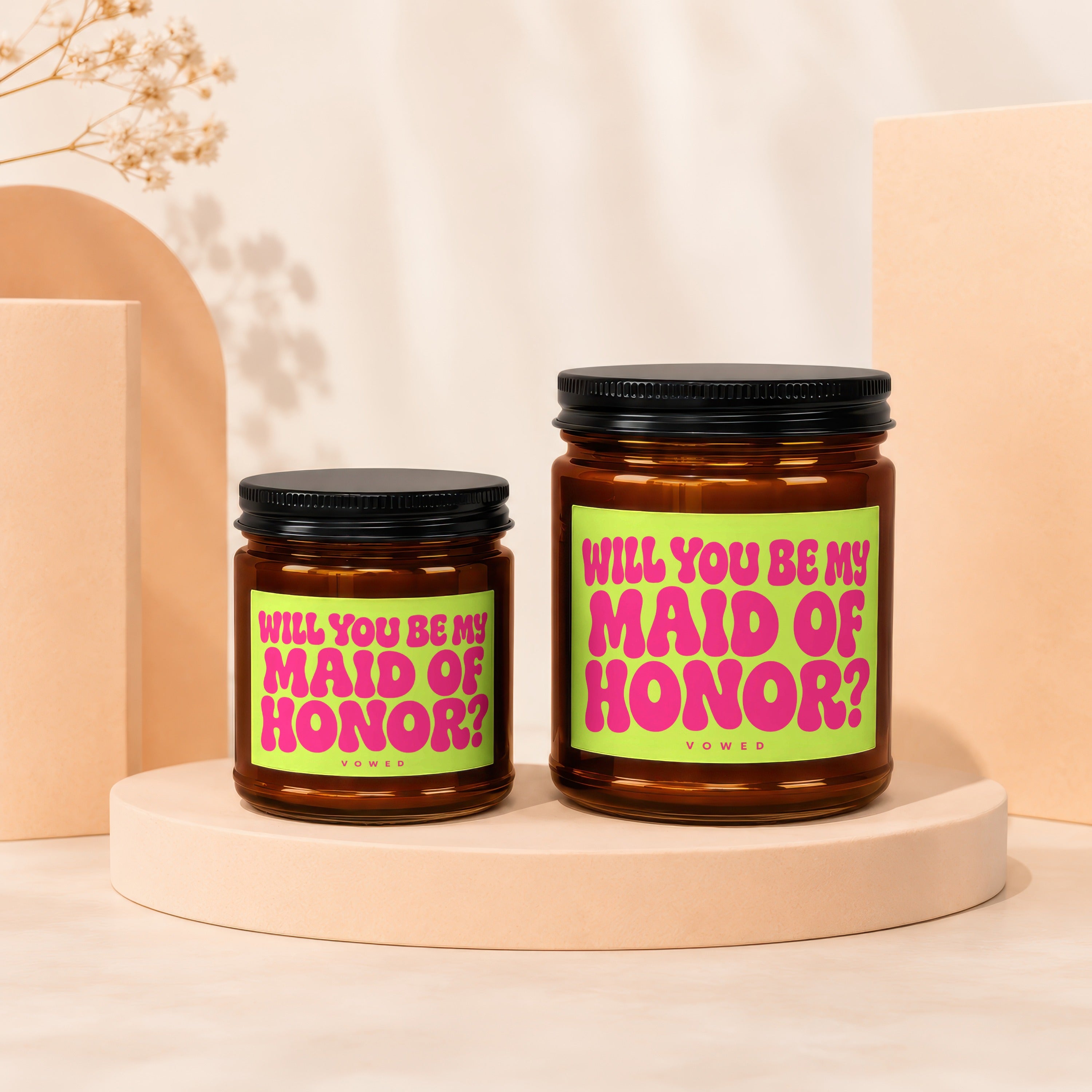 Two amber glass candles with green labels asking "Will You Be My Maid of Honor?"