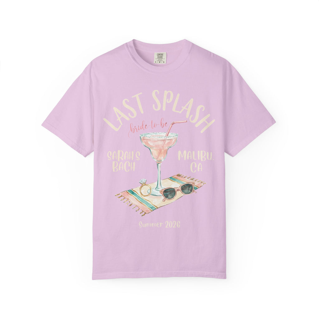 Pink t-shirt with "Last Splash bride-to-be" text, ring, sunglasses, and cocktail.