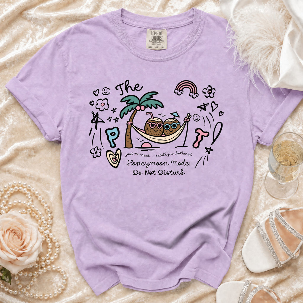 Lavender t-shirt with "The Honeymoon Mode: Do Not Disturb" graphic and hammock coconuts.