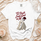 White t-shirt with 'Til Death Looks Good on Me text and skeleton hand with rose.