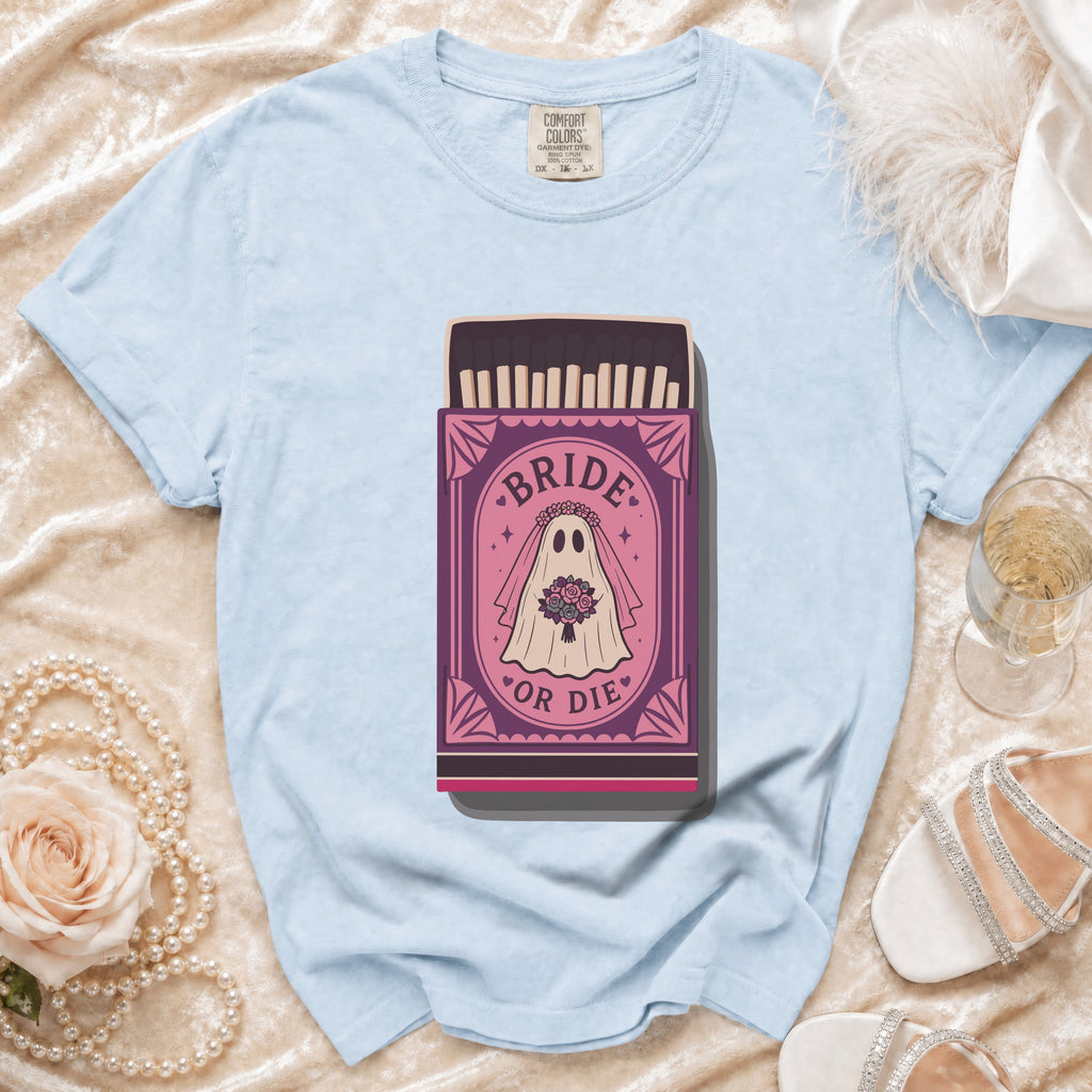 Light blue t-shirt with "Bride or Die" ghost in matchbox graphic.