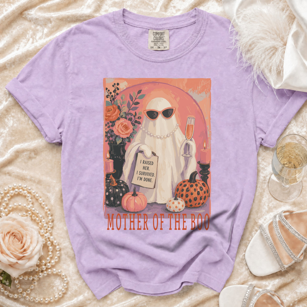 Purple t-shirt with "Mother of the Boo" graphic of a ghost with sunglasses, pearls, and text.