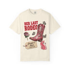 Cream t-shirt with "Her Last Rodeo" text, cowboy boot, and butterflies.