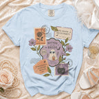 Light blue t-shirt with "Mother of the Bride" Halloween-themed graphic featuring stamps and ghost.