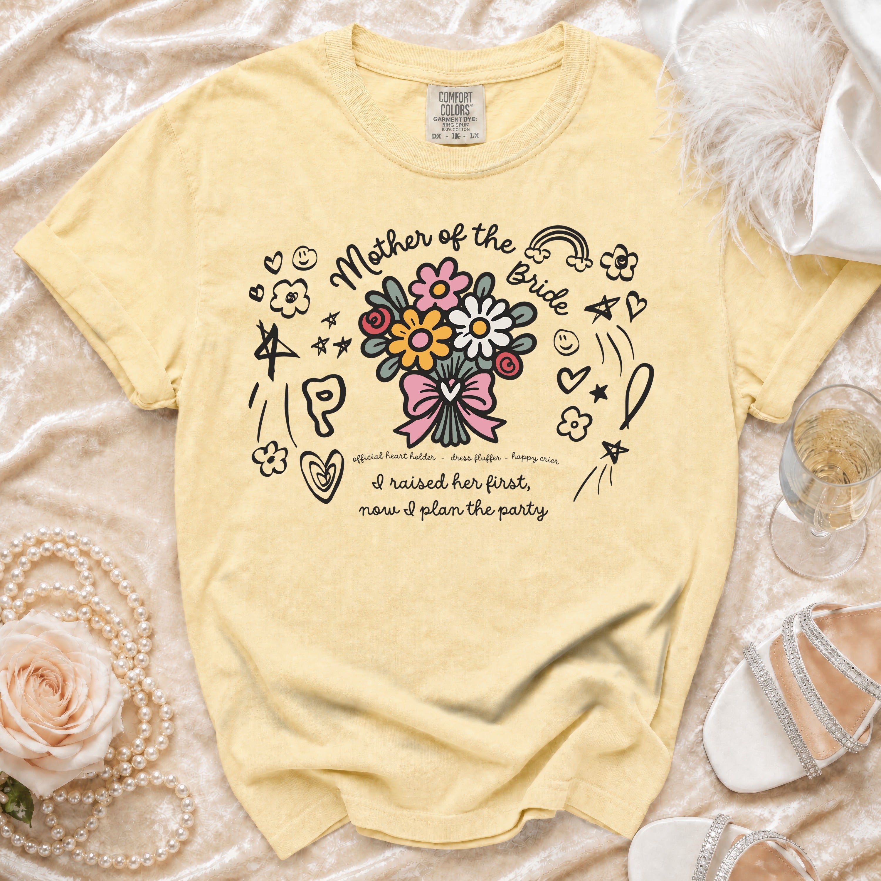 Yellow t-shirt with "Mother of the Bride" text and floral bouquet design.