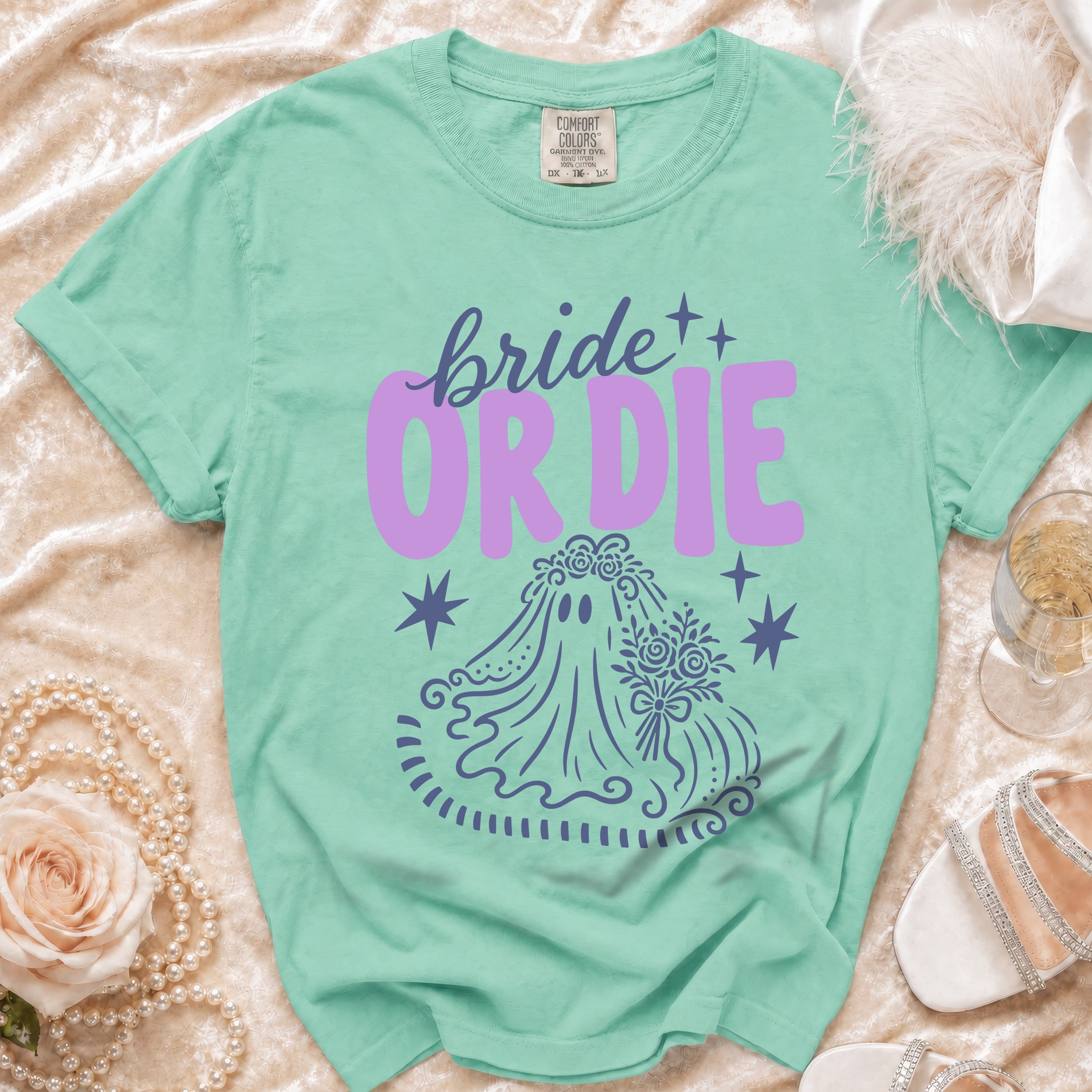 Mint green t-shirt with "bride or die" text and ghost bride graphic.